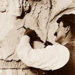Stone carver carving stone, at the Cathedral of Saint John the Divine, New York, 1909.