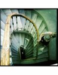 image of woman descending spiral staircase