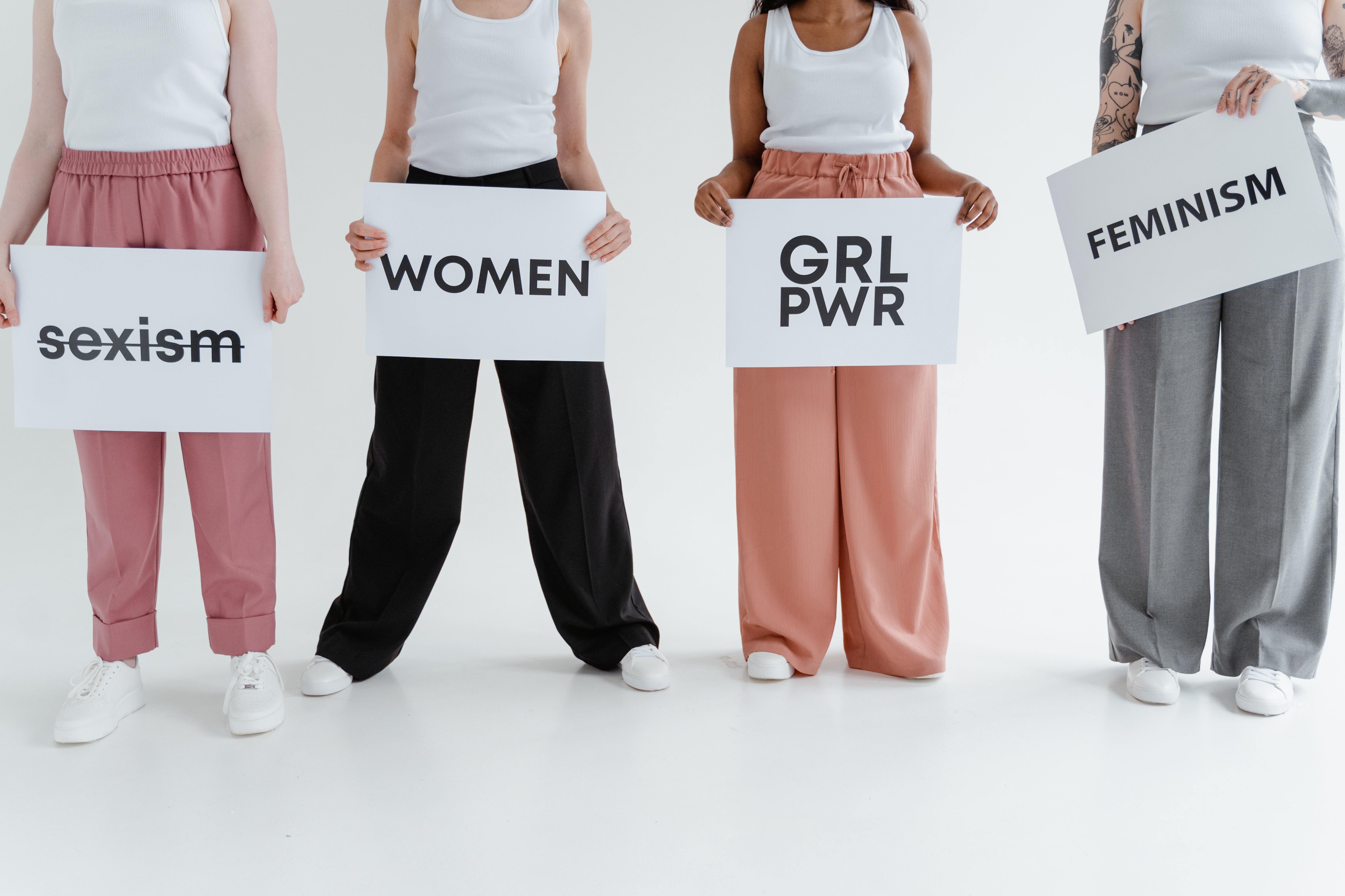 4 Women with feminism signs